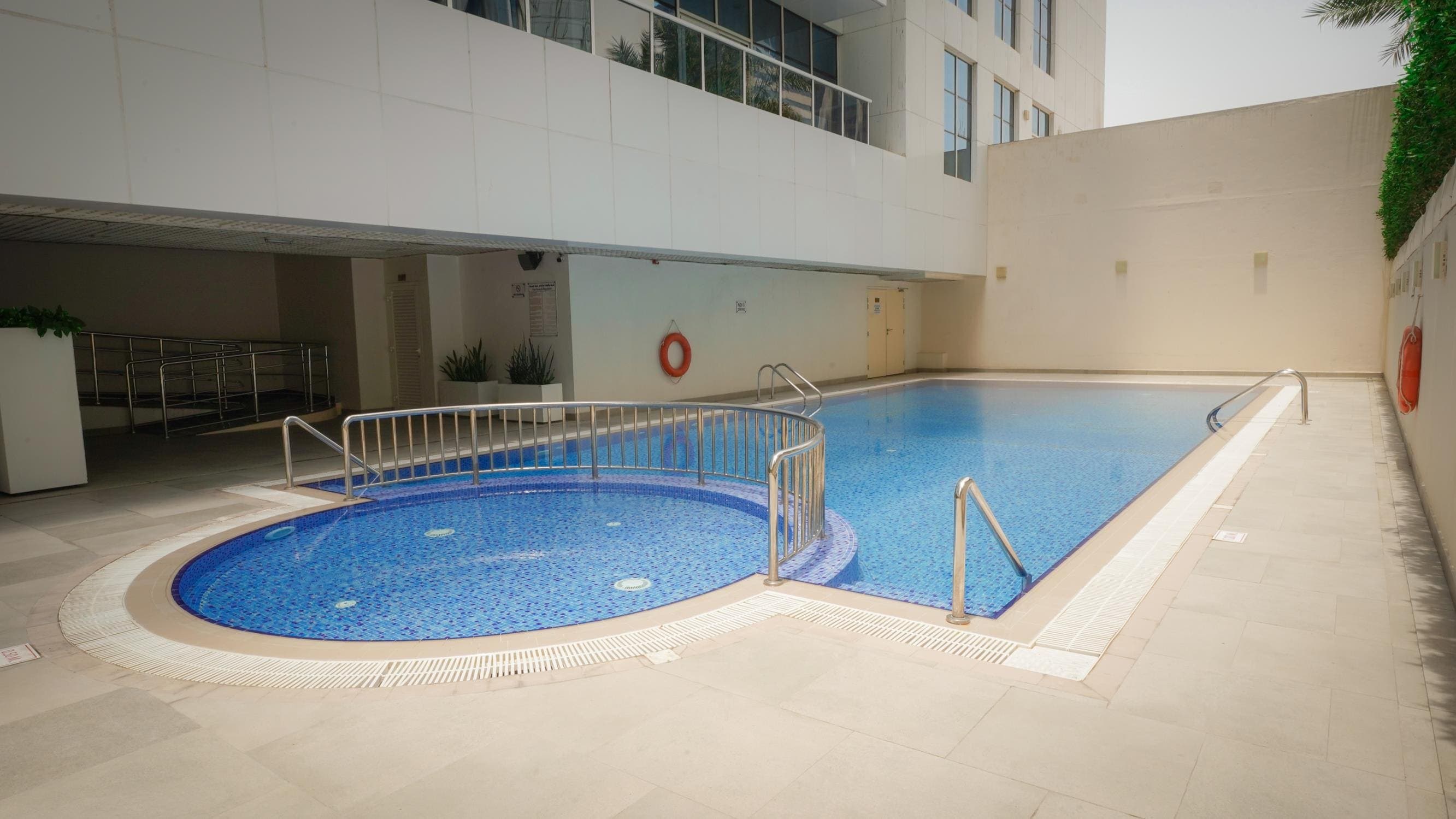 Marina Arcade Tower amenity Swimming Pool - Dubai Marina, Dubai - by Mada'in Properties