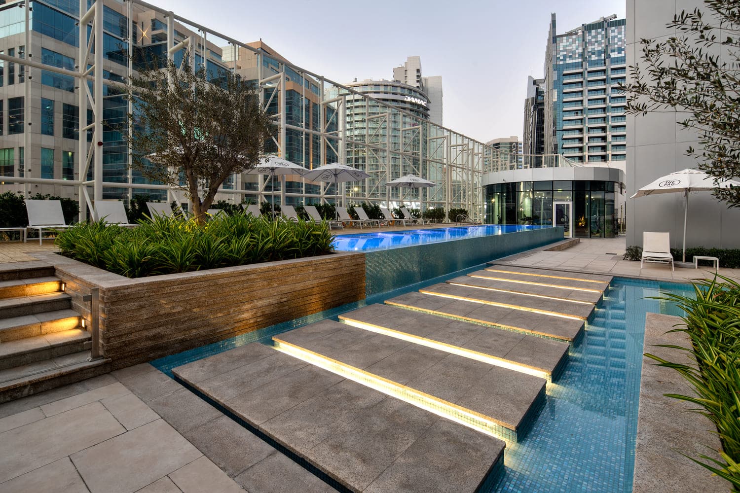 The Pad by Omniyat amenity The Pad’S Pool, With Cabanas And Tanning Deck - Business Bay, Dubai - by Beyond Developments